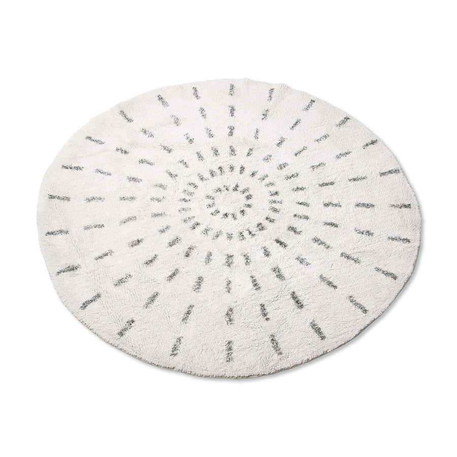 round rug with black and white swirl pattern