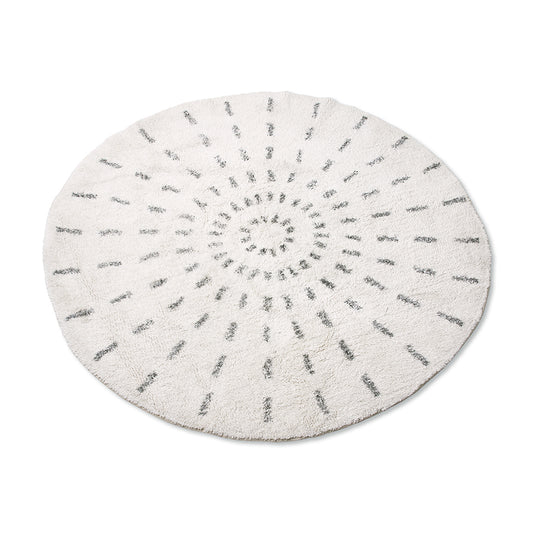 round rug with black and white swirl pattern