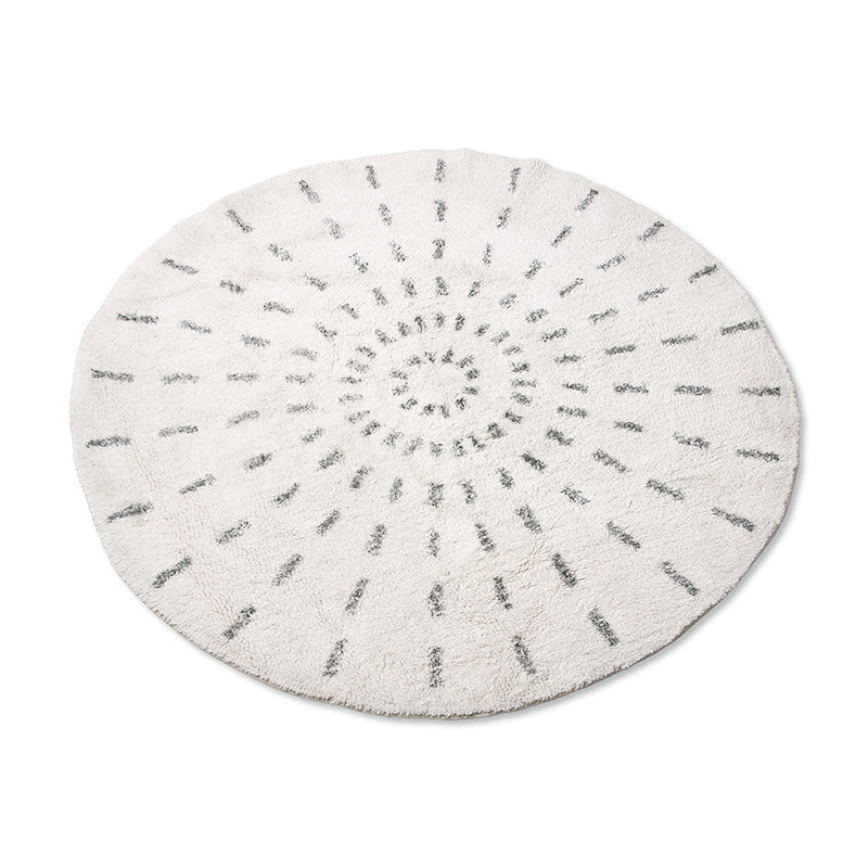 round rug with black and white swirl pattern