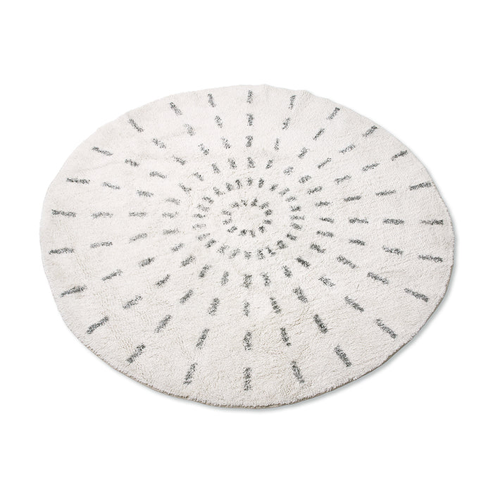 round rug with black and white swirl pattern
