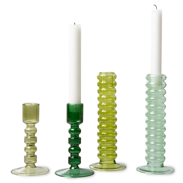 two tall and two lower green glass candle stick holde
