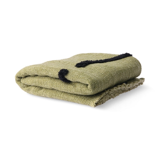 folded, pistachio green throw blanket made from cotton with black tufted lines