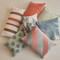pile of pillows in soft colors