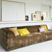 brown corduroy sofa with yellow pillows for contrast