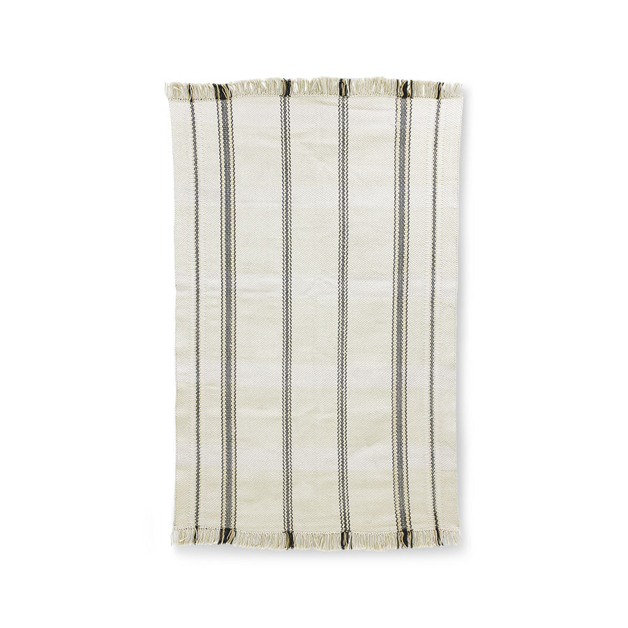handwoven rug with fringes in an off white color with black stripes woven into it