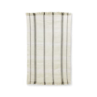 handwoven rug with fringes in an off white color with black stripes woven into it