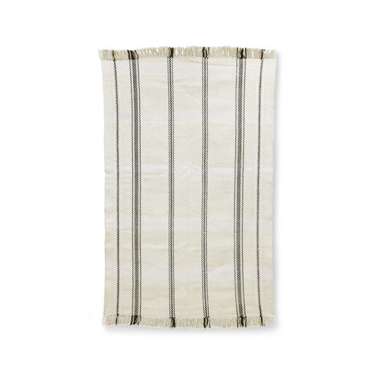 handwoven rug with fringes in an off white color with black stripes woven into it