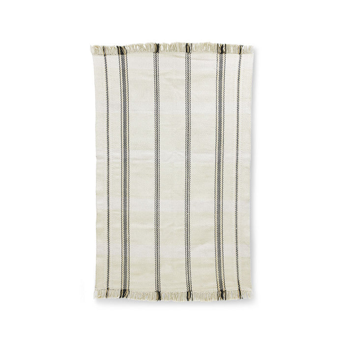handwoven rug with fringes in an off white color with black stripes woven into it