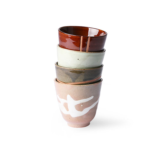 four stoneware tea mugs stacked