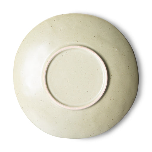 back of a speckled green side plate