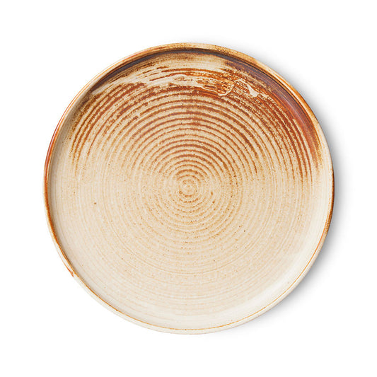 cream and brown round porcelain side plate