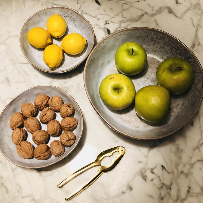 large and medium grey organic shaped bowls with fruit and nuts