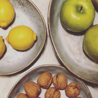 rustic grey bowls with fruit and nuts