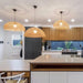kitchen with 3 flat wicker lights hanging over kitchen island