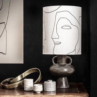 charcoal base and printed faces lampshade combination