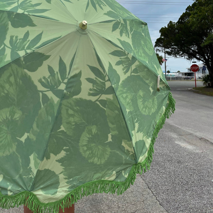 detail of green flower pattern sturdy beach umbrella 