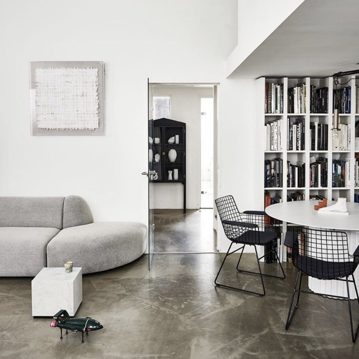 living room with white dining table and marble side table