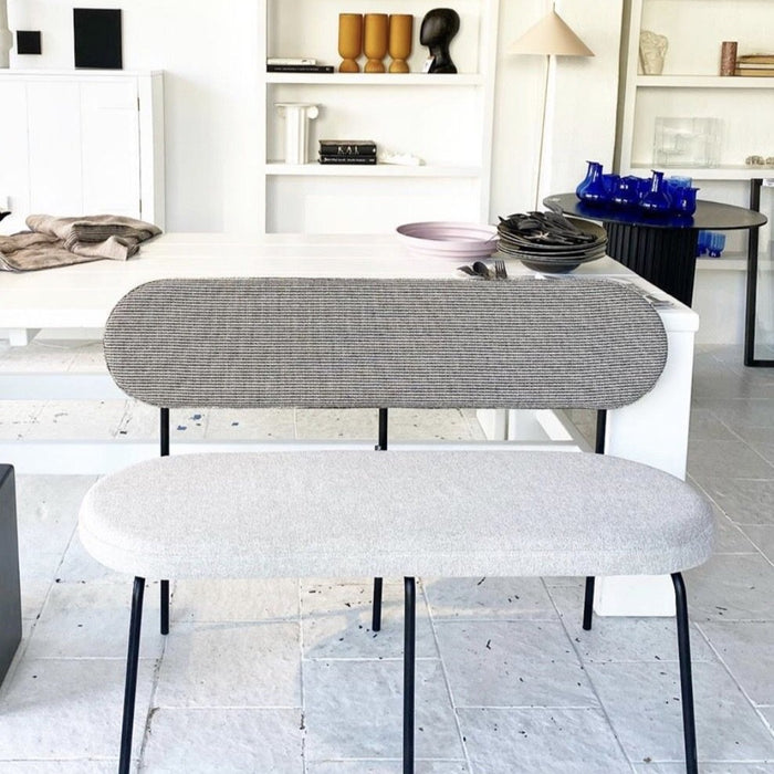 grey bench with two different fabrics in casual setting