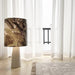 table lamp with jungle print and grey base on floor in living room