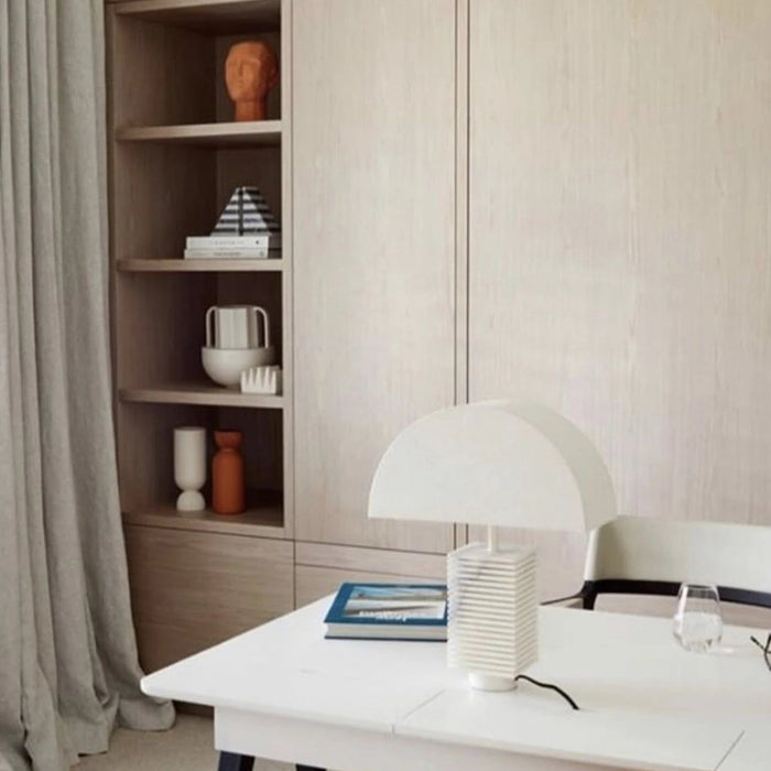 home office with shelving that hold a Greek inspired white vase with two handles