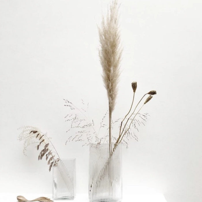 clear ribbed vases with dried flowers