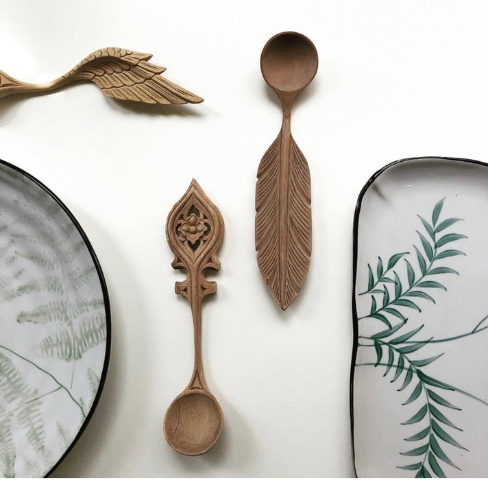 serving plate with green fern pattern and wooden spoons