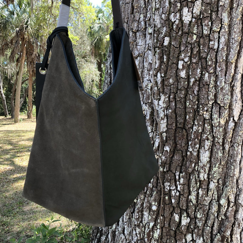 mossy green leather bag in natural light