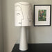 printed lamp shade with faces on a grey base