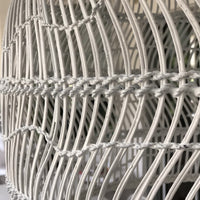 close up of white wicker basket light