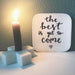 marble candle stick holder with burning candle and letter signage