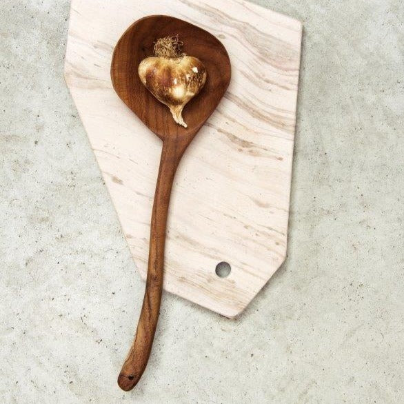 wooden ladle on a marble plate