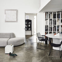 mid century modern room with white table and black metal chairs