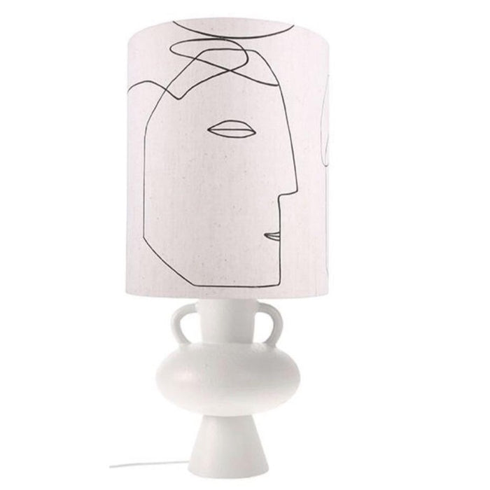 white table lamp with face print on a whate base with handles