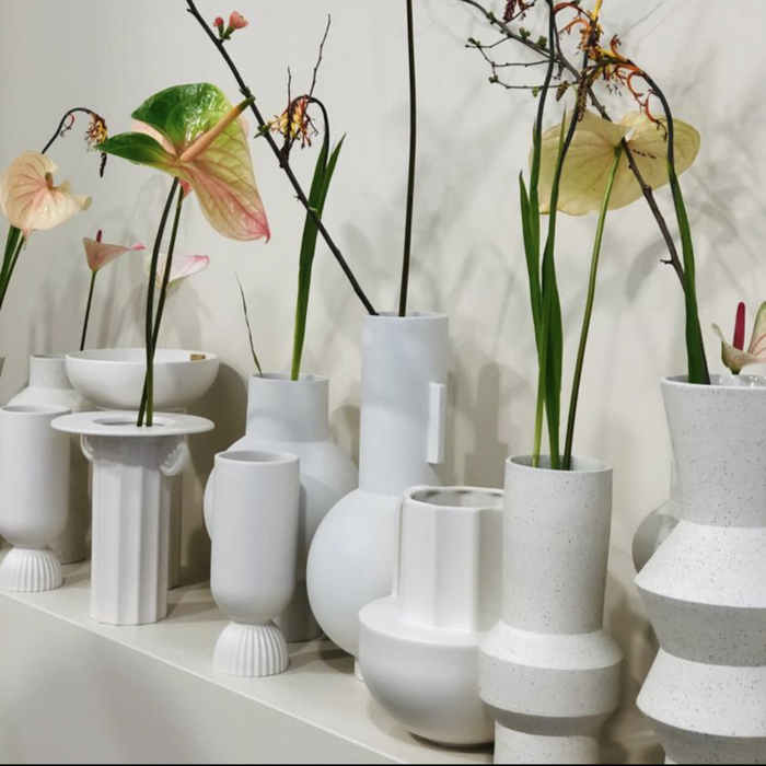white vases with spring flowers