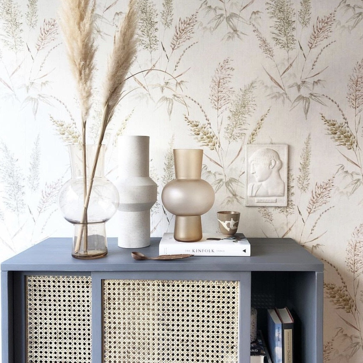 grey sliding door cabinet with white vase