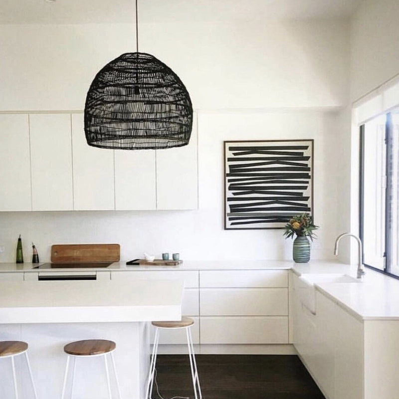 medium blavk wicker pendant in white kitchen