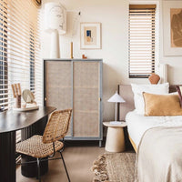 bedroom setting with stone ware side table as night stand