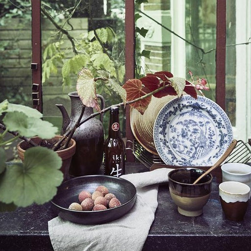 dispaly setting with kyoto ceramics and plants
