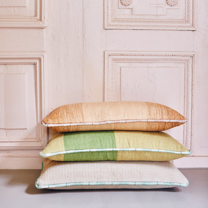 stack of 3 handwoven woolen lumbar pillows in Spring colors with white piping