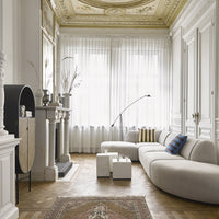 living room with natural color sofa and white marble block coffee tables