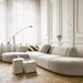 lounge area with grey sofa and set of 3 white marble block tables