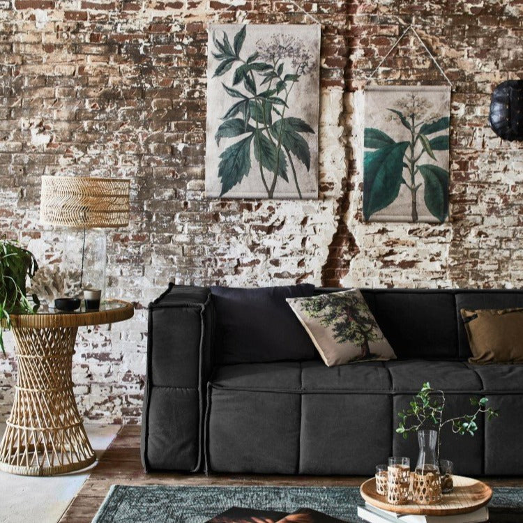 living room with charcoal canvas coach and white pillow with oak tree image