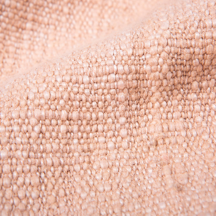 close up of soft woven throw blanket pink